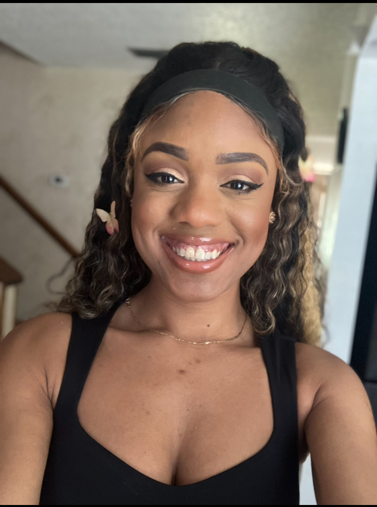 Woman smiling inside of a home.